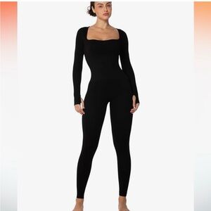 NWOT Black Long Sleeve QQQ Bodysuit